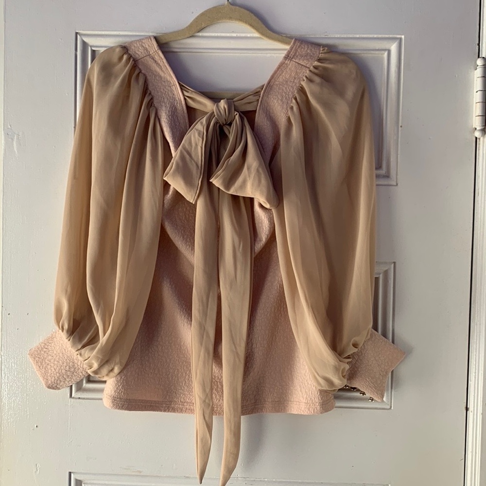 Boho princess billowy sleeved top, with long draping bow at back.